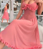 House dress made of tulle with ruffles at the chest and tail