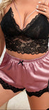 Two-piece pajama consisting of a lace top and satin shorts