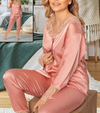 Two-piece pajama made of satin with lace around the neck