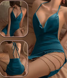 Lingerie made of satin with metal chains on one side and an open back