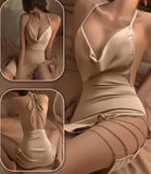 Lingerie made of satin with metal chains on one side and an open back