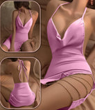 Lingerie made of satin with metal chains on one side and an open back