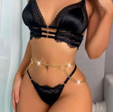 Two-piece lingerie made of satin and lace with a metal chain on the stomach