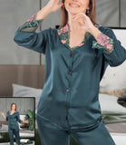 Two-piece pajama made of satin with lace at the sleeves, the end of the trousers and around the neck