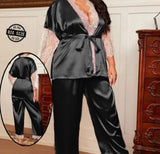 Two-piece pajamas made of satin with lace on the sleeves at the chest and the end of the trousers