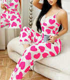 Two-piece pajamas made of cotton with a heart print and lace around the chest