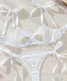 Two-piece lingerie made of lace with satin ties at the shoulders and sides
