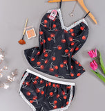 Two-piece pajamas made of satin with a cherry print and lace around the edges