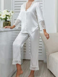Two-piece pajama made of satin with lace at the sleeves, pants ends, and shoulders