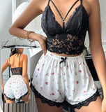 Two-piece pajama consisting of cotton shorts and a lace top