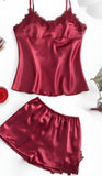 Two-piece pajama made of satin with lace around the chest