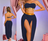 A two-piece belly dance suit made of chiffon with metal rings under the chest