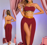 A two-piece belly dance suit made of chiffon with metal rings under the chest