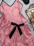 Two-piece satin pajama with ruffles at the end of the shorts