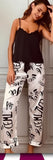 Two-piece satin pajama - with English letters printed on the pants - Dala3ny