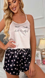 Two-piece satin pajamas - with hearts print on the shorts and eyelashes print on the top - Dala3ny